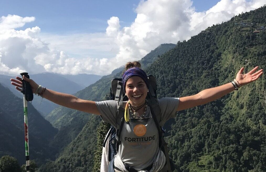 Allie, Youth International, Nepal Girl backpacking on mountain.