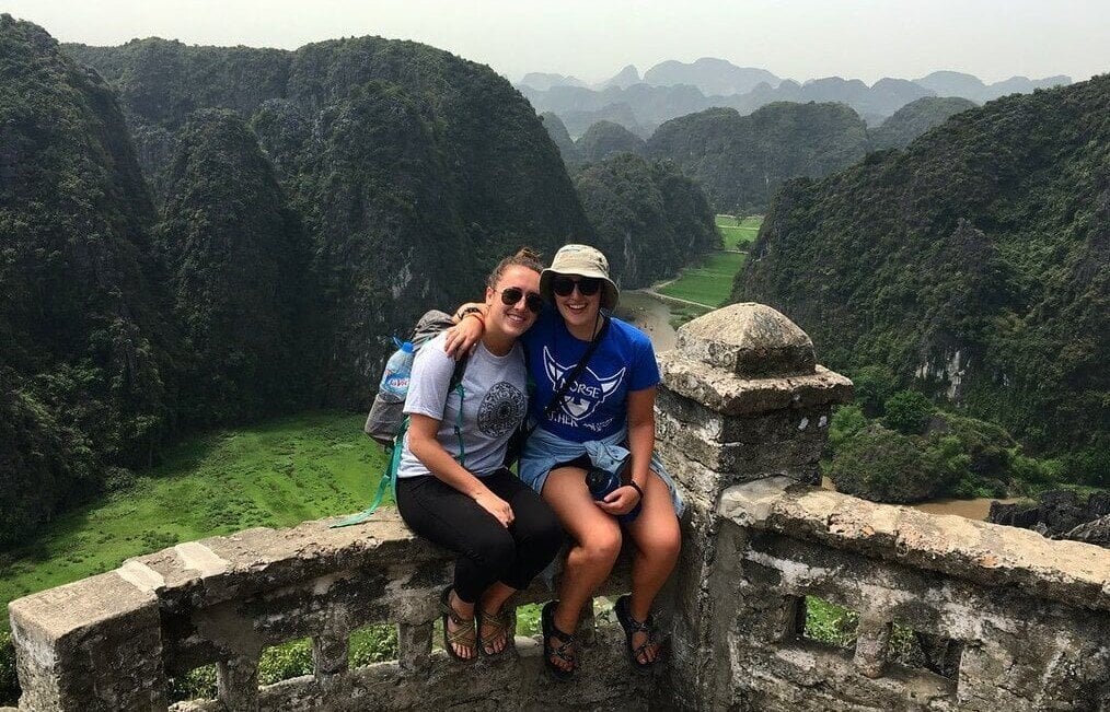 Ashley, CIS Abroad Thailand Two travelers sitting in front of mountains.