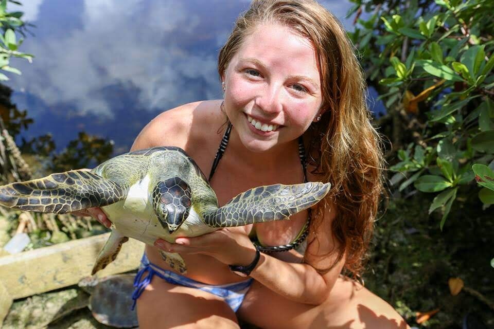 Liberty T., The Science Exchange Costa Rica Girl holding sea turtle and smiling
