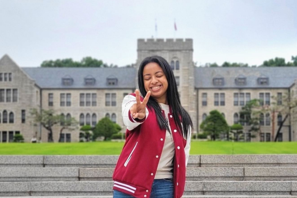 A student in front of a university